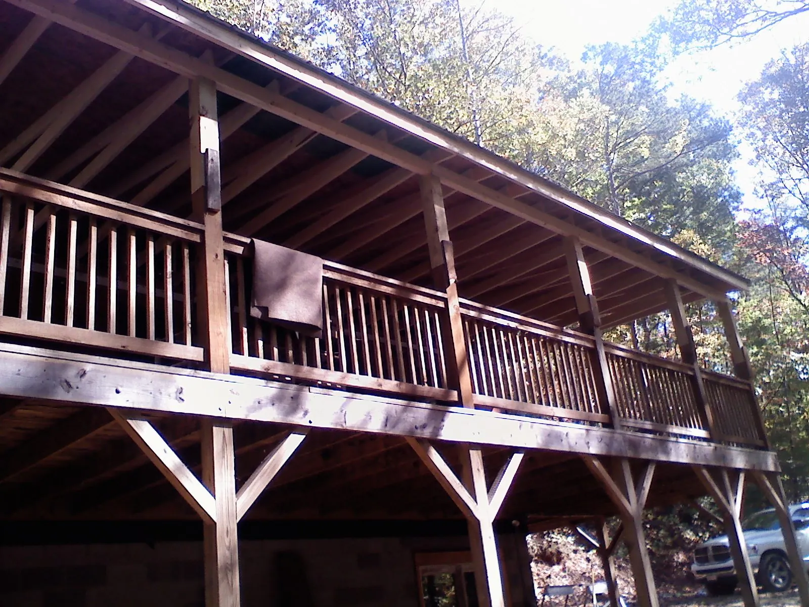 Timber framing under a new elevated porch and deck — Roof Leak Repair in Fiskdale by Roofing Brothers